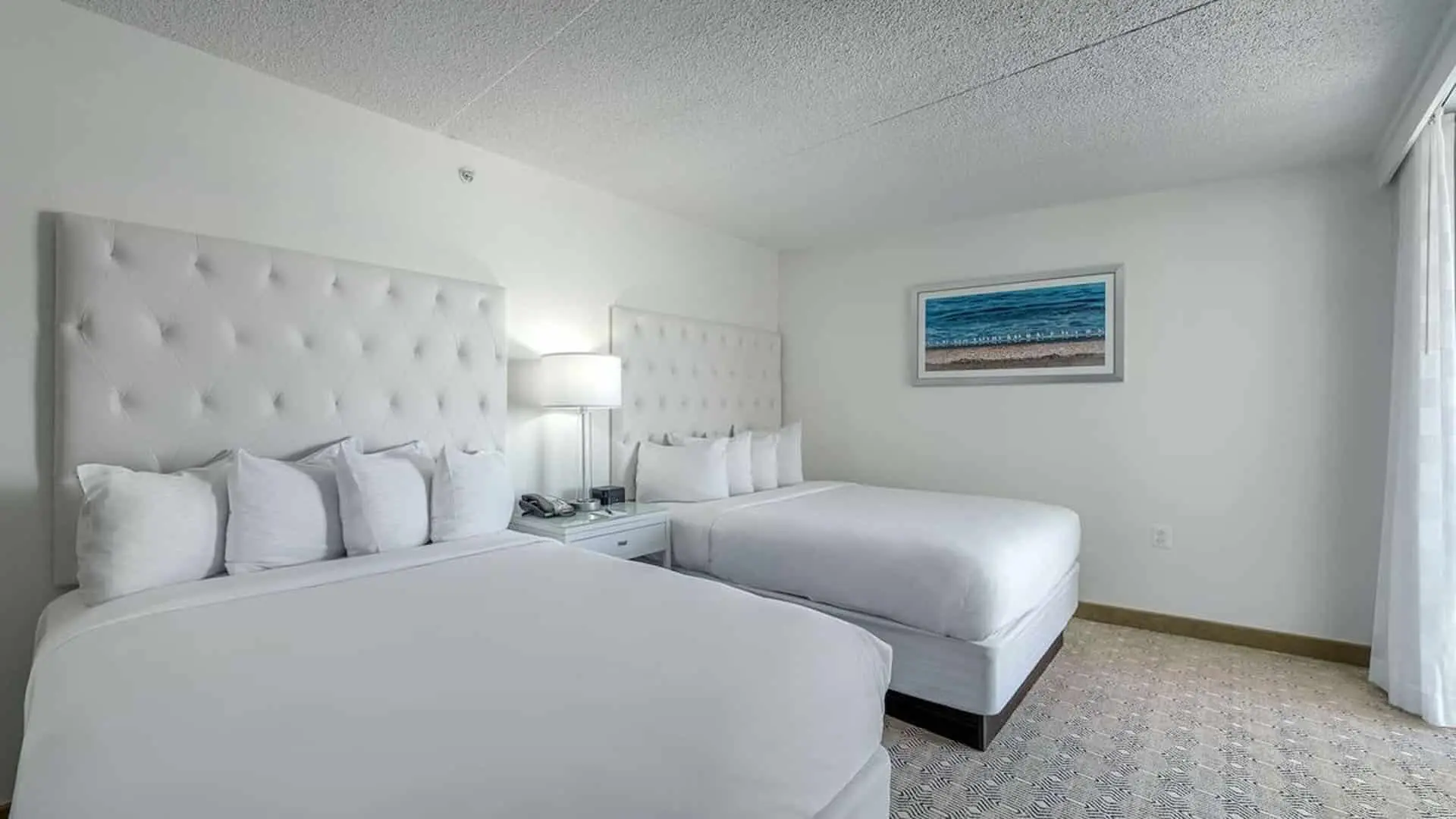 Premium poolside double suite hotel room beds