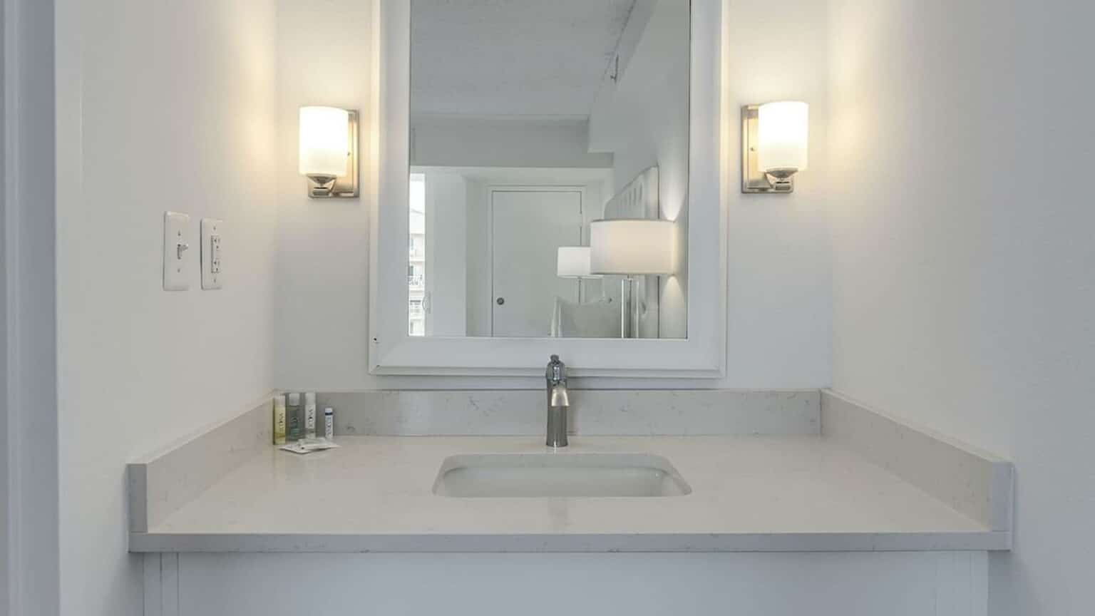 Premium poolside king suite hotel room bathroom sink