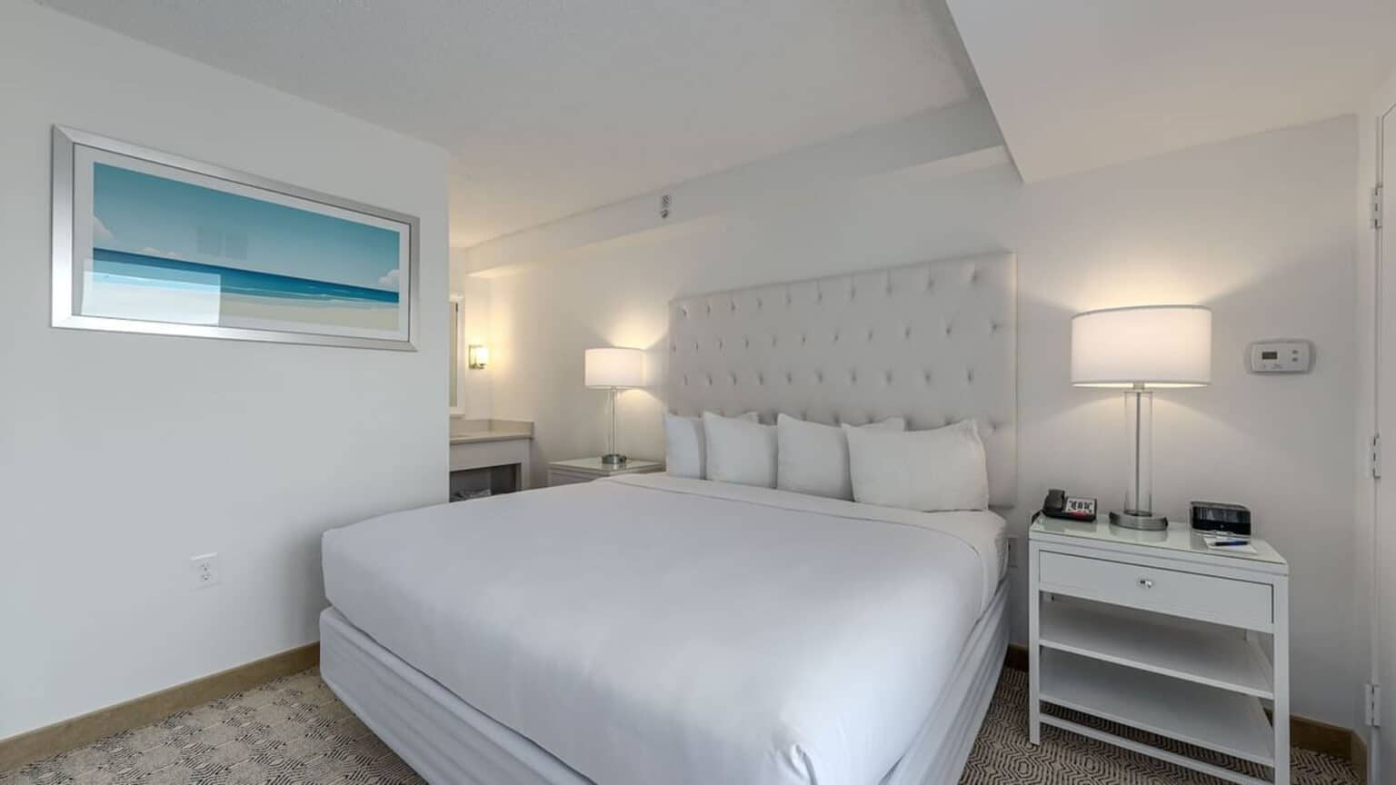 Premium poolside king suite hotel room bed