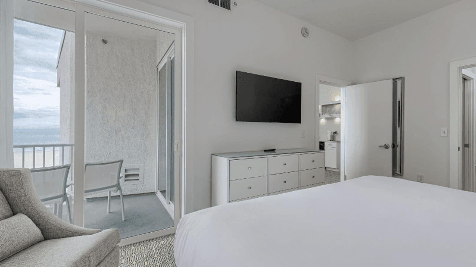 ICONA Diamond Beach top floor king suite hotel room view of TV from bed