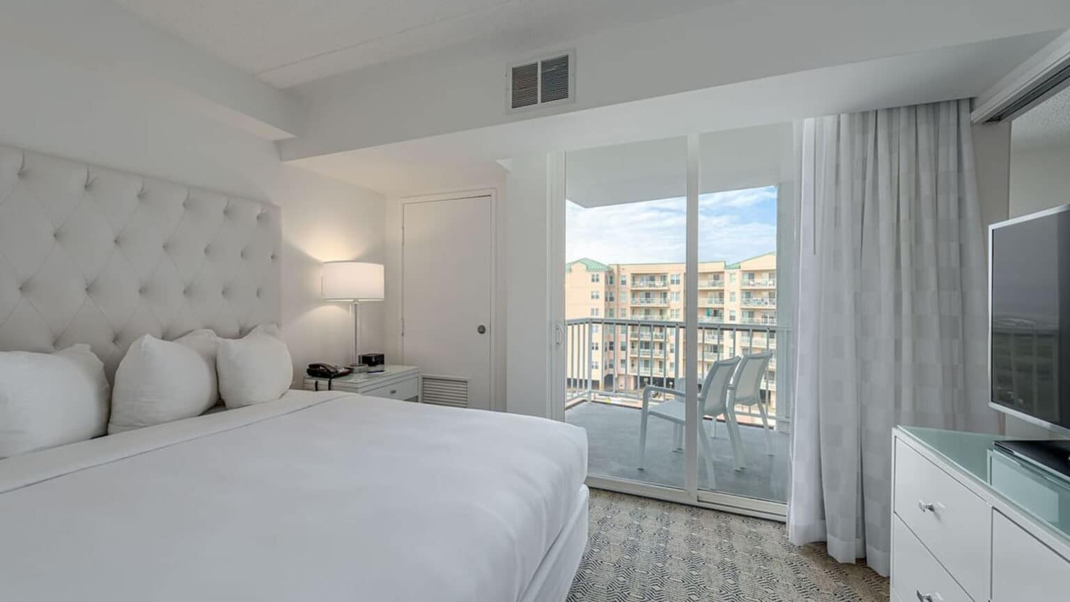 Premium poolside king suite hotel room with balcony