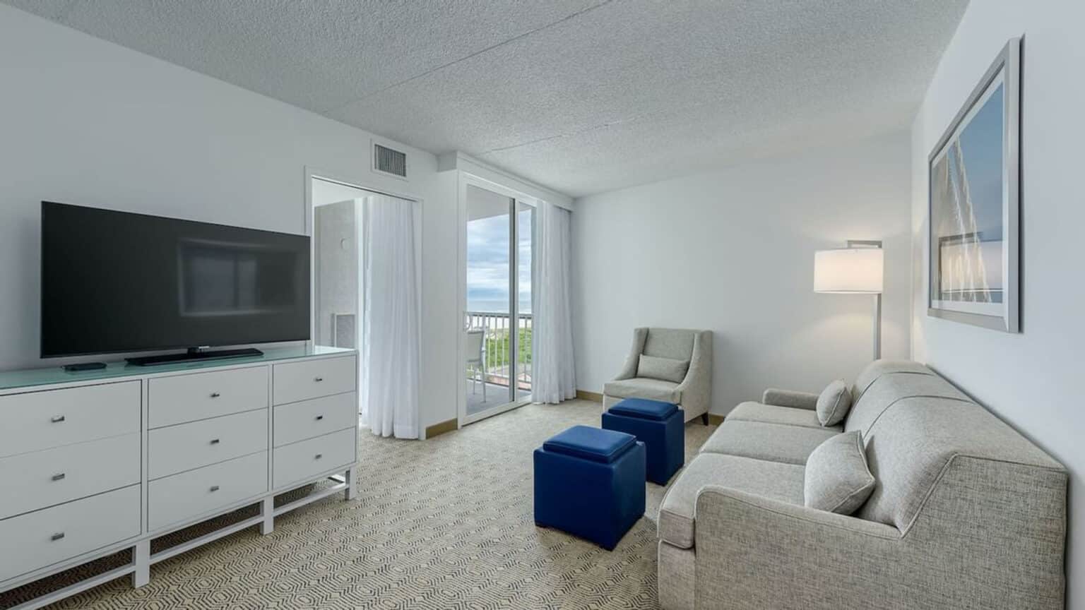 Premium poolside king suite hotel room living room