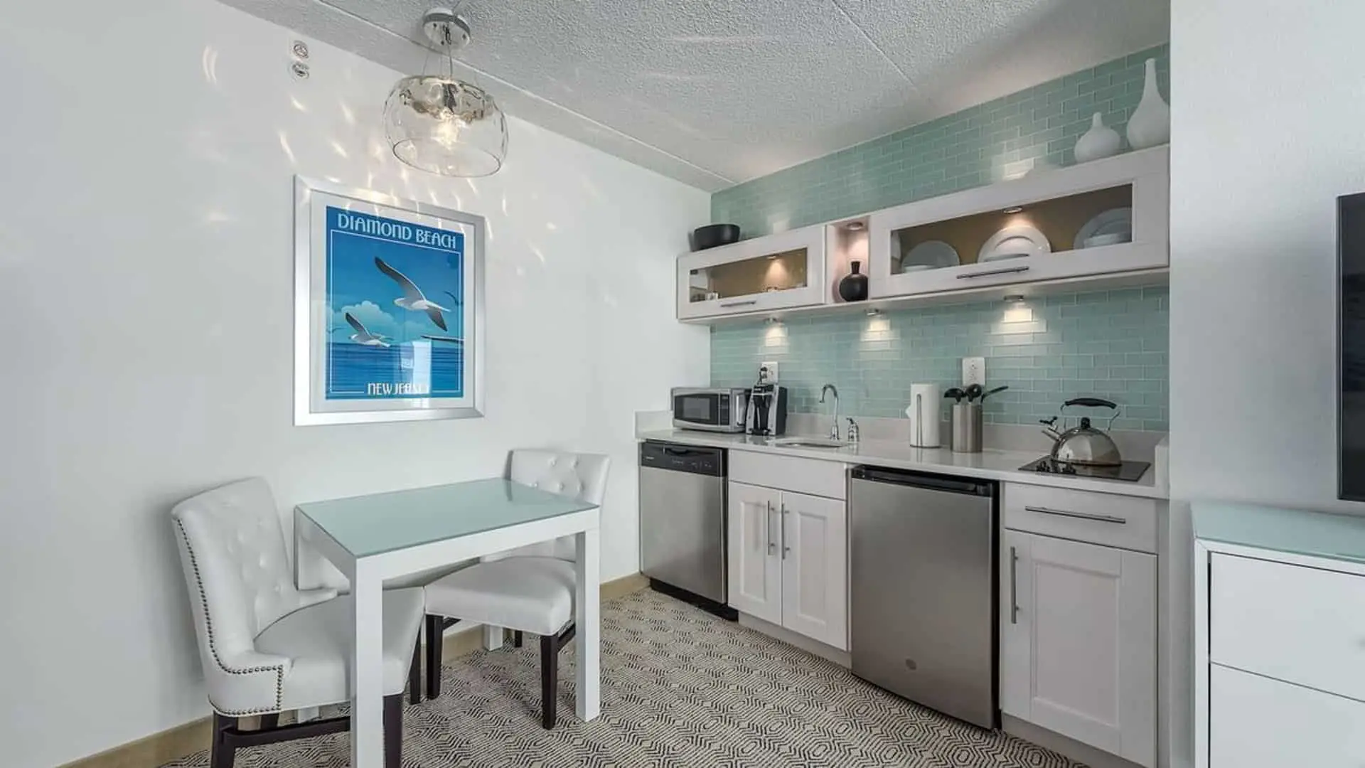 Premium poolside double suite galley kitchen and seating area