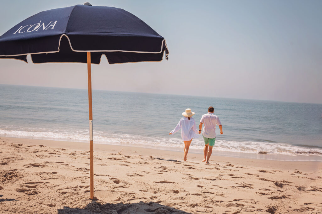 Couple walking into the ocean in Diamond Beach