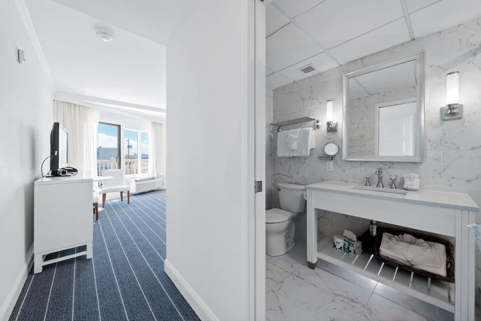 Classic king hotel room entrance and bathroom