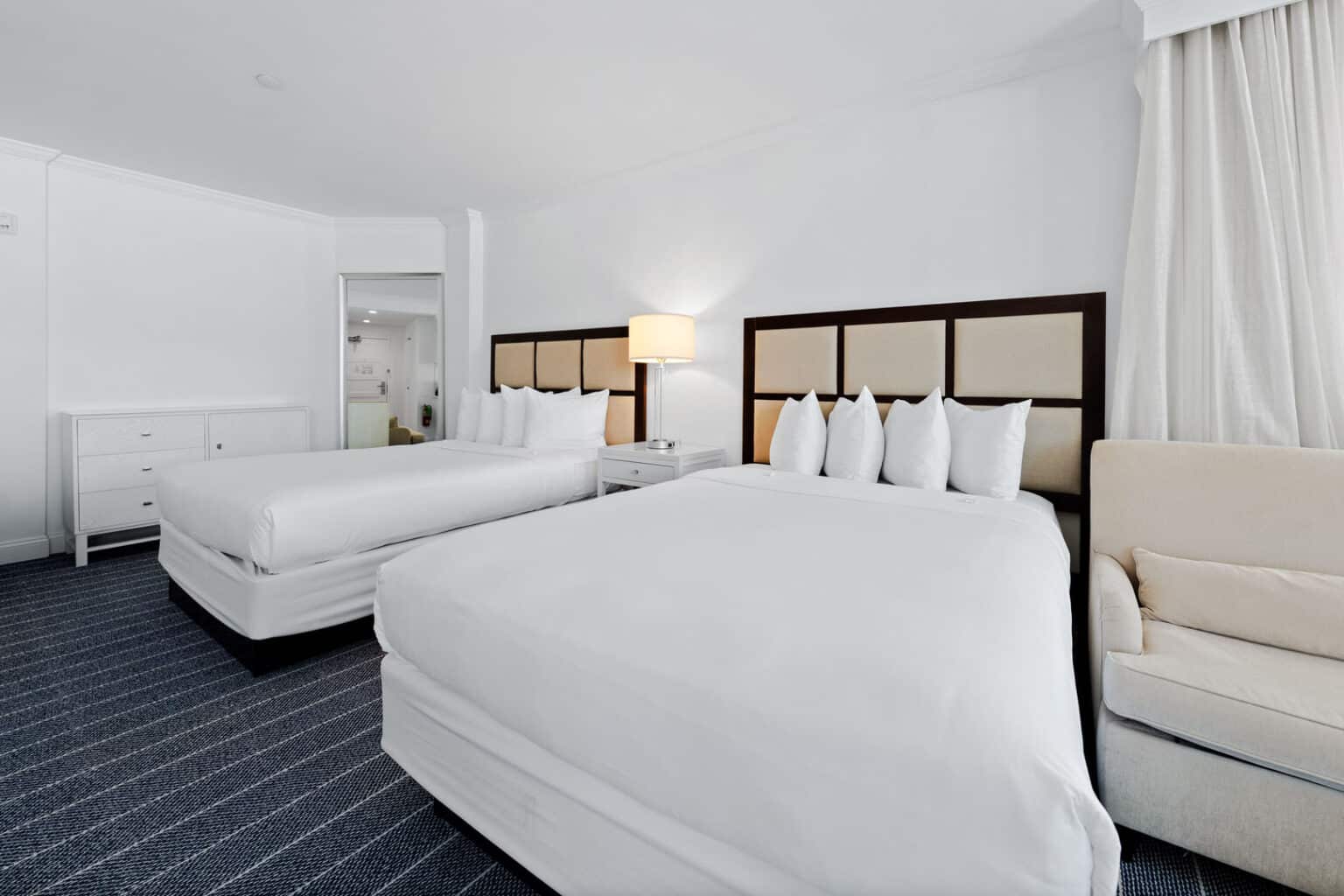 Premium family suite beds in hotel room