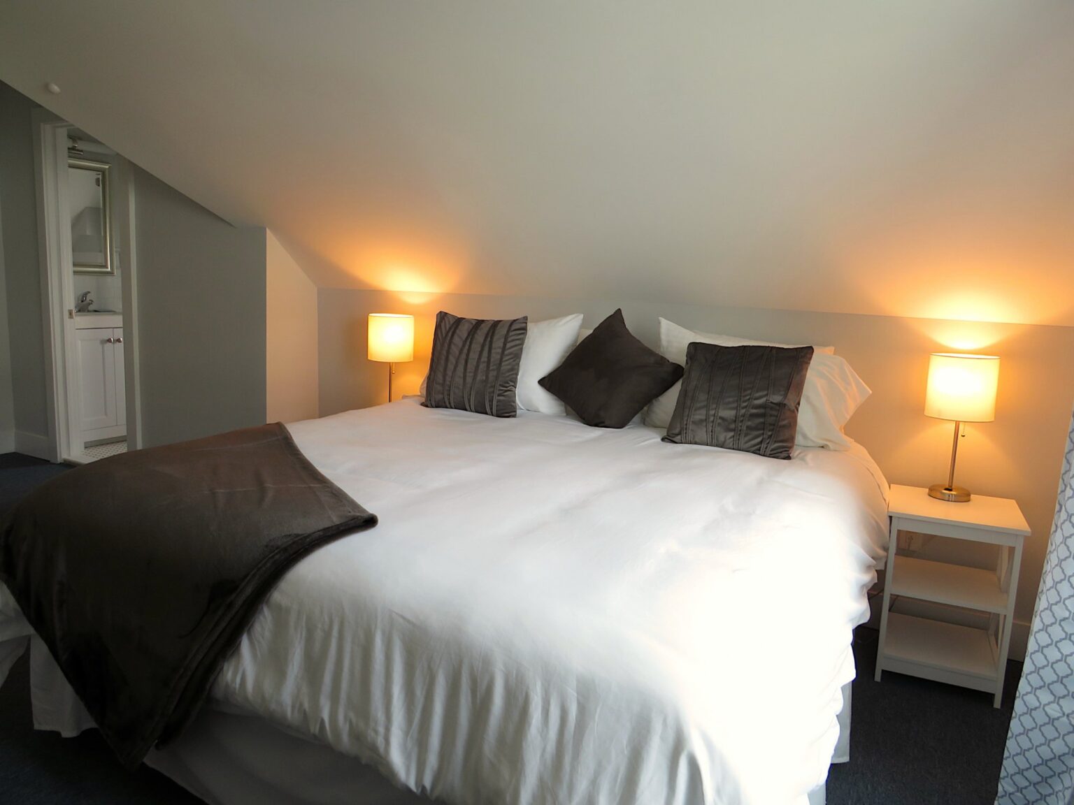 The bed in Room 18 at the Grand Victorian Hotel in Spring Lake