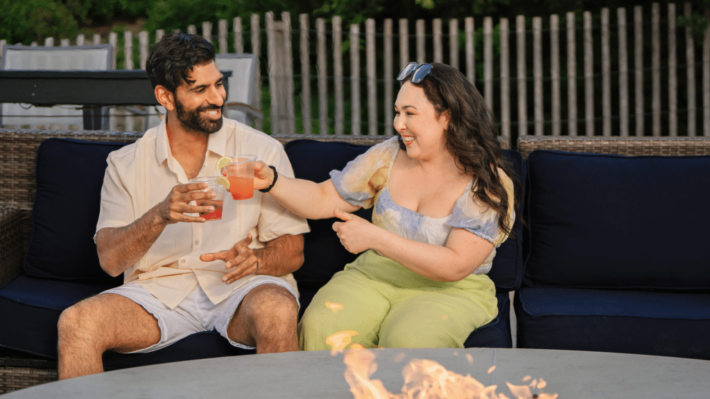 Couple at a fire pit at The Sandbar Village