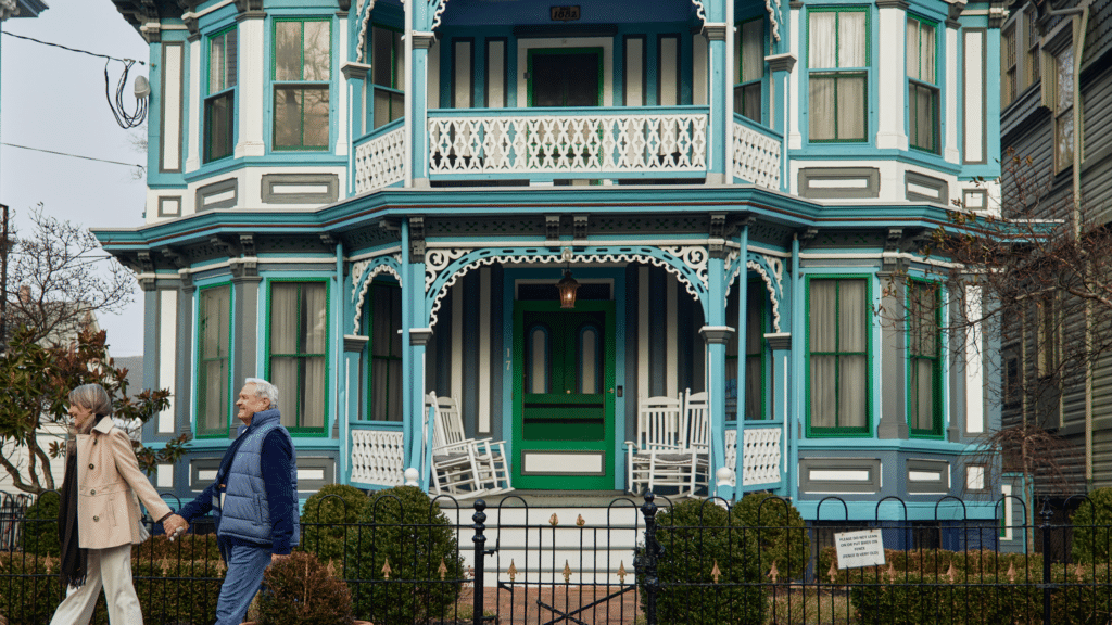 Couple walking in front of a Victorian Home in Cape May