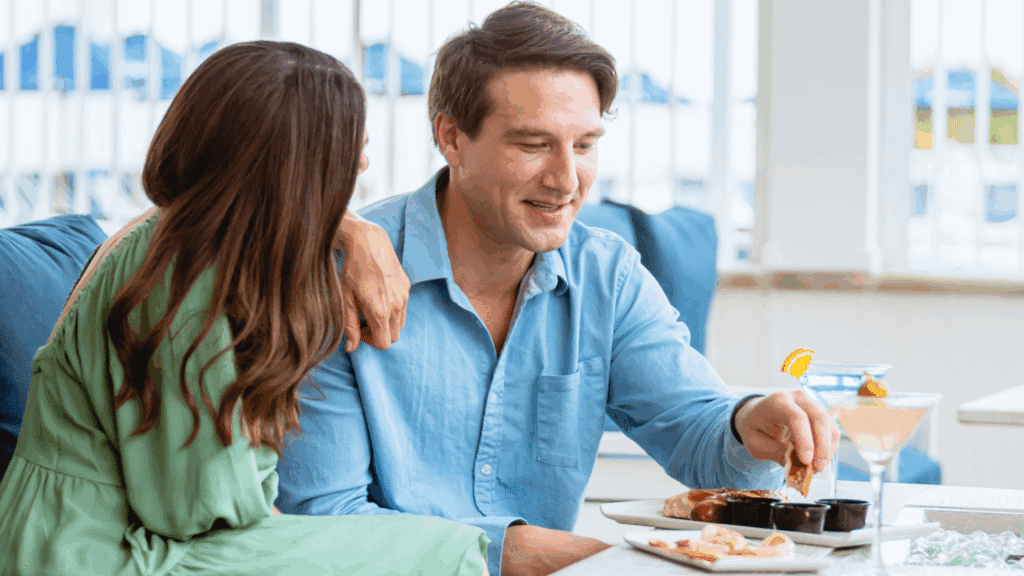Couple enjoying appetizers and drinks together at Coastal Blue restaurant near Wildwood, NJ.