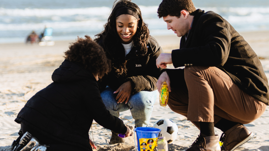 Family playing on the beach in Spring in Avalon, NJ