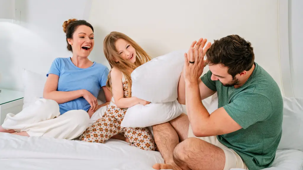 Family having a pillow fight on a spring break getaway at the New Jersey Shore